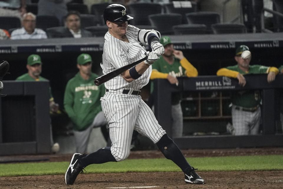 New York Yankees' Josh Donaldson strikes a pitch for a double that drives in two runs during the seventh inning of a baseball game against the Oakland Athletics, Monday, June 27, 2022, in New York. (AP Photo/Bebeto Matthews)