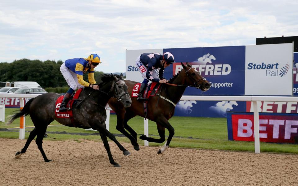 London Prize ridden by Fran Berry (right) wins the Betfred Northumberland Vase Handicap ahead of Graceland ridden by Louis Steward during the Betfred Northumberland Plate Day at Newcastle Racecourse - Richard Sellers/PA Wire
