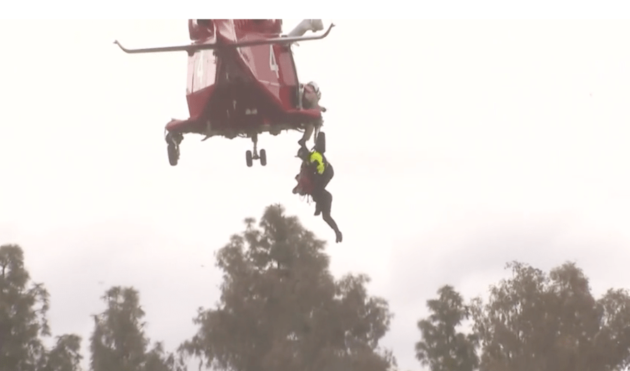 Firefighters rescue woman from storm-flooded L.A. River