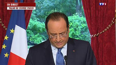 France's President Francois Hollande makes a televised statement at the Elysee Palace in Paris, in this still image taken from video shot by France's private TF1 television channel, and aired on its midday news broadcast on October 19, 2013. Hollande declared that the 15-year-old Kosovar schoolgirl, Leonarda Dibrani, who was arrested by police during a school trip and deported to Kosovo, could return to France and continue her education, if she made an official request. REUTERS/TF1/Handout via Reuters