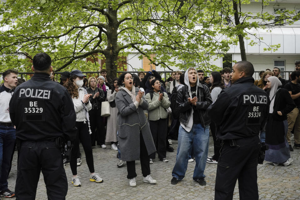 Protestors shout slogans during a pro-Palestinians protest rally at the 'Freie Universitaet' university in Berlin, Germany, Tuesday, May 7, 2024. (AP Photo/Markus Schreiber)