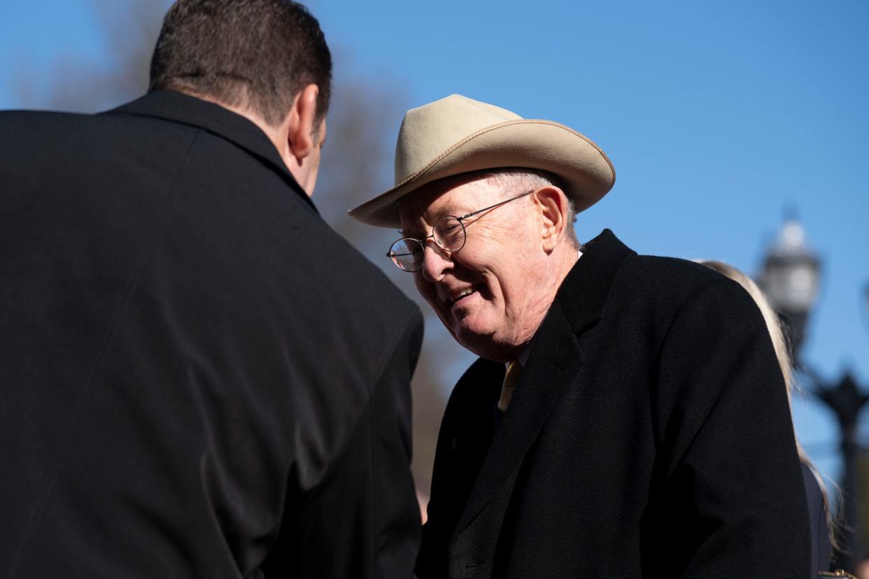 Former U.S. Senator and Tenn. Governor Lamar Alexander visits with guest on the podium during the Inauguration Ceremony for Governor Bill Lee at Legislative Plaza Saturday, Jan. 21, 2023, in Nashville, Tenn. 