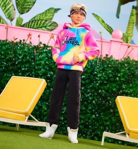 <p>Mattel</p> Mattel's new Ken Doll inspired by Ryan Gosling's character in "Barbie" wearing an "I am Kenough" sweatshirt.