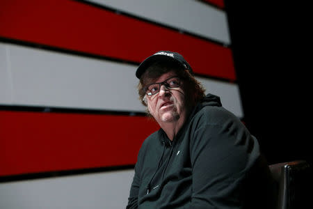 Michael Moore looks off stage during an interview at the site of his one-man Broadway show at the Belasco Theatre in Manhattan, New York, U.S., August 17, 2017. REUTERS/Shannon Stapleton