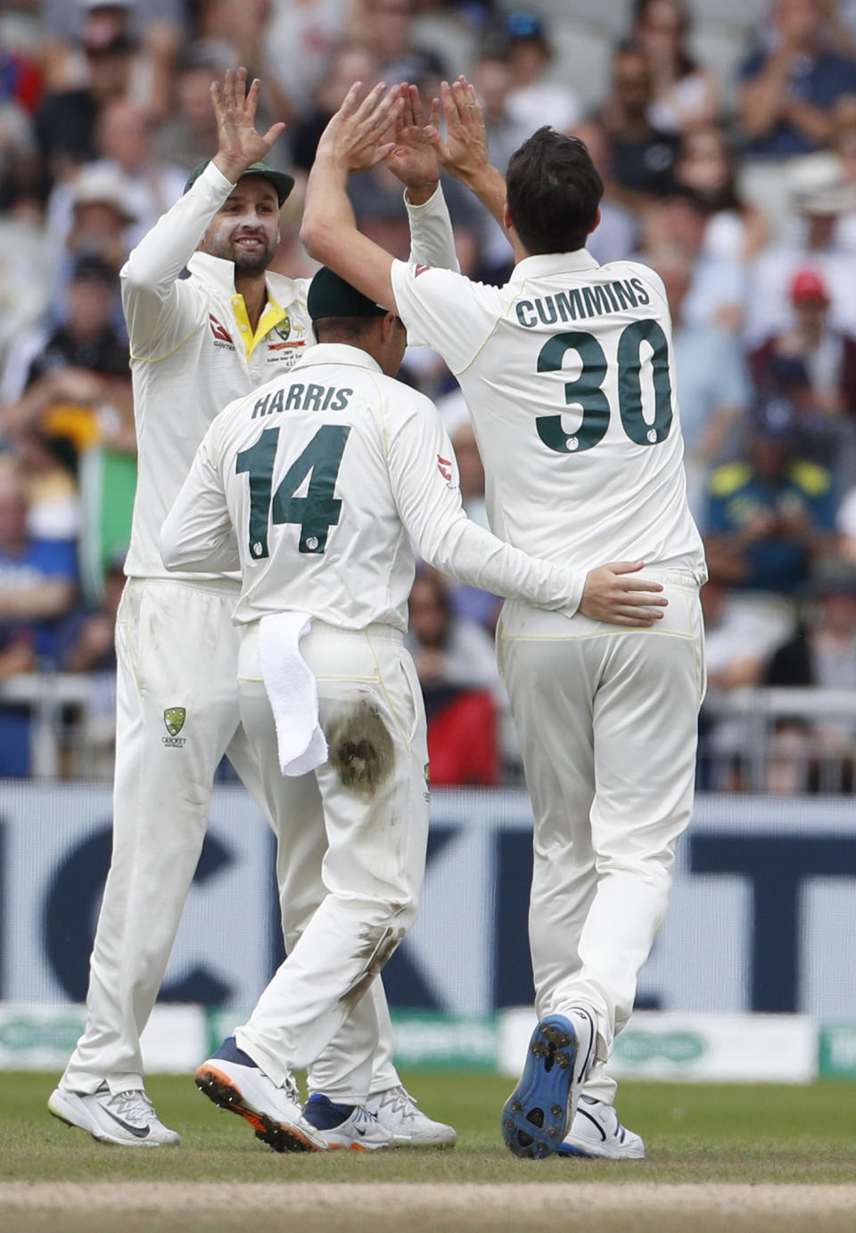 Australia's Pat Cummins, right, celebrates with teammates after dismissing England's Jason Roy during day five of the fourth Ashes Test cricket match between England and Australia at Old Trafford in Manchester, England, Sunday Sept. 8, 2019. (AP Photo/Rui Vieira)