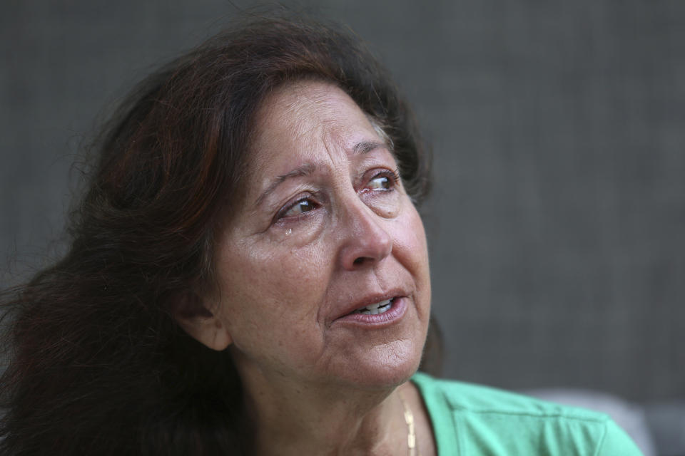 Suzy Elghanayan speaks during an interview at the Selah Carefarm in Cornville, Ariz., Oct. 4, 2022. "There's a comfort in knowing," says Elghanayan, whose son died earlier in the year of a seizure, "that we're all in the same place that we never wanted to be." (AP Photo/Dario Lopez-Mills)
