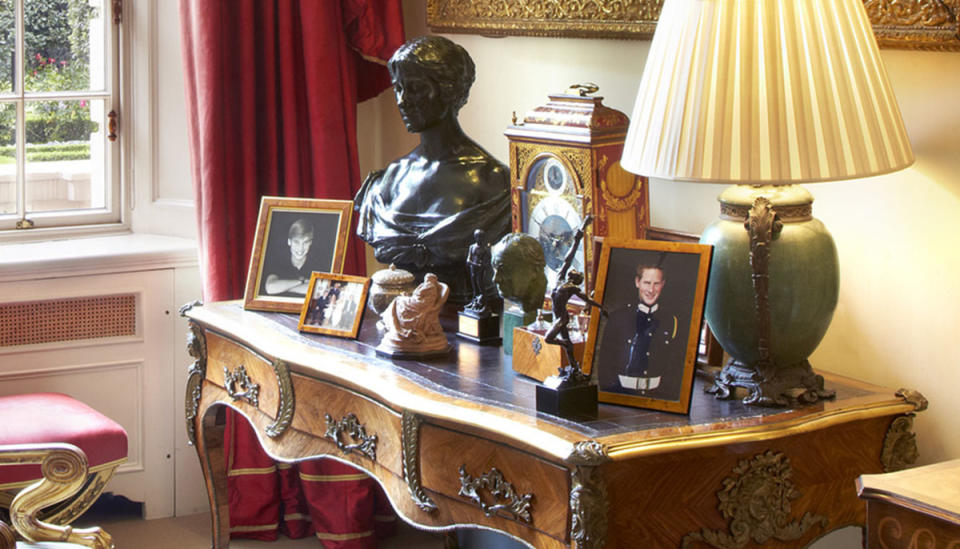 A portrait of Prince Harry (right) sits far apart from his brother, Prince William on a wooden desk Inside The Garden Room in Clarence House. Photo: Twitter/ClarenceHouse.