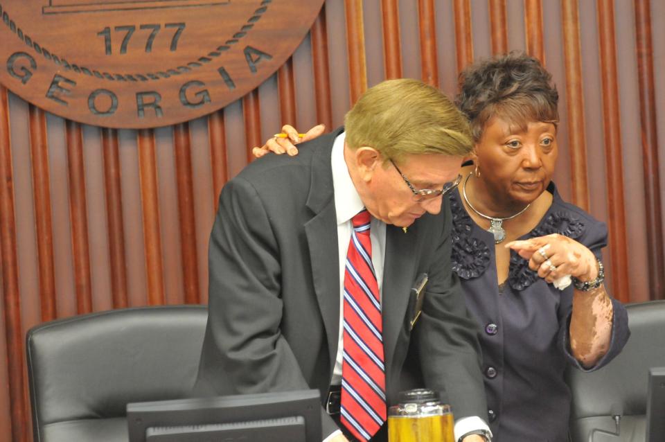 Chatham County Commission Chairman Pete Liakakis talks with Vice Chair Priscilla Thomas before the start of  the December 21, 2012 Commission meeting.