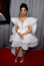 <p>Cardi B, who is up for two awards in the rap category at the 60th Annual Grammy Awards, wore an unusual structural white gown on the red carpet. (Photo: John Shearer/Getty Images) </p>
