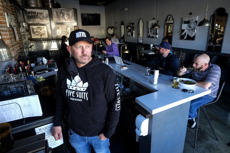 Brian Gruber, owner of Notorious Burgers, is photographed at his restaurant in Carlsbad, Calif., on Friday, Dec. 18, 2020. (AP Photo/Ringo H.W. Chiu)