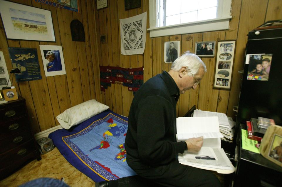 Bishop Thomas Gumbleton looks for some files, Feb. 14, 2005, in Detroit, he needed to prepare for a talk he was giving at St. Francis Church in Toledo, Ohio. This is the room where he lives adjacent to the office at St. Leo's Catholic Church, where he was the pastor.
