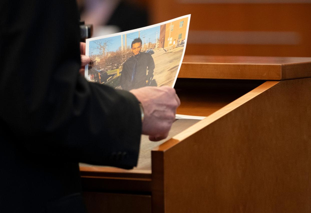 Special Prosecutor Tim Merkle holds a photo of Casey Goodson Jr. that was admitted into evidence in the trial of former Franklin County Sheriff's deputy Michael Jason Meade, who is charged with murder and reckless homicide in connection with Goodson's death in December 2020.