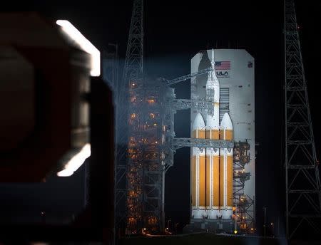 File photo of a United Launch Alliance Delta IV Heavy rocket with NASA's Orion spacecraft mounted atop is seen in this handout photo after the Mobile Service Tower was finished rolling back early on December 4, 2014, at Cape Canaveral Air Force Station's Space Launch Complex 37, Florida. REUTERS/Bill Ingalls/NASA/Handout via Reuters