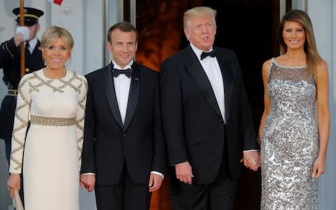 US President Trump and first lady Melania welcome French President Macron and his wife for a State Dinner at the White House in Washington - Credit: Reuters