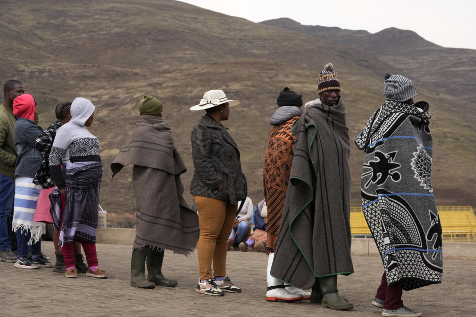 People line up to cast their votes at a polling station in Thaba-Tseka District, 82km east of Maseru, Lesotho, Friday, Oct. 7, 2022. Voters across Lesotho are heading to the polls Friday to elect a leader to find solutions to high unemployment and crime. (AP Photo/Themba Hadebe)