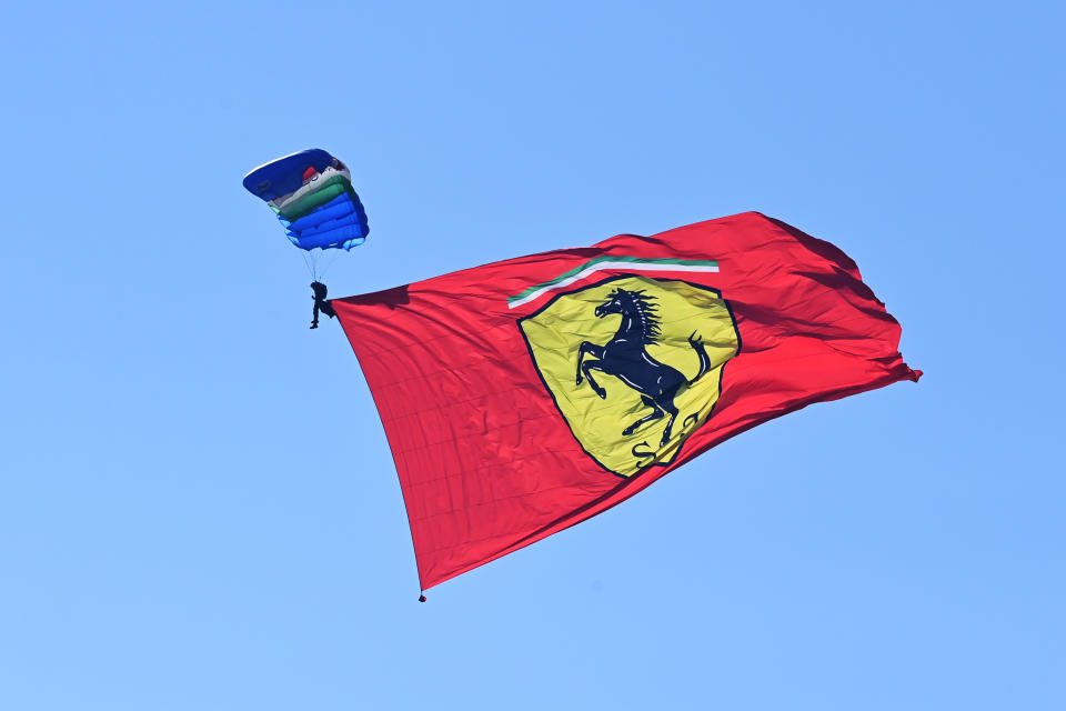 SCARPERIA, ITALY - SEPTEMBER 13: A parachutist displays a Scuderia Ferrari flag over the circuit prior to the F1 Grand Prix of Tuscany at Mugello Circuit on September 13, 2020 in Scarperia, Italy. (Photo by Miguel Medina - Pool/Getty Images)