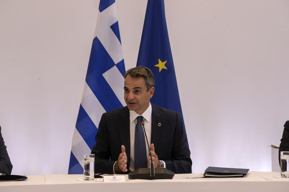 Greek Prime Minister Kyriakos Mitsotakis speaks during a meeting in Athens, on Wednesday, July 28, 2021. Greece is hosting a one-day trilateral meeting of the three leaders. (AP Photo/Yorgos Karahalis)