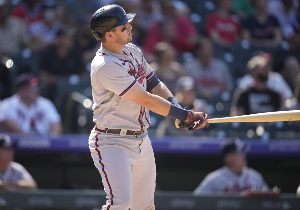 Atlanta Braves' Austin Riley follows the flight of his two-run home run off Colorado Rockies relief pitcher Julian Fernandez in the seventh inning of a baseball game Sunday, Sept. 5, 2021, in Denver. (AP Photo/David Zalubowski)