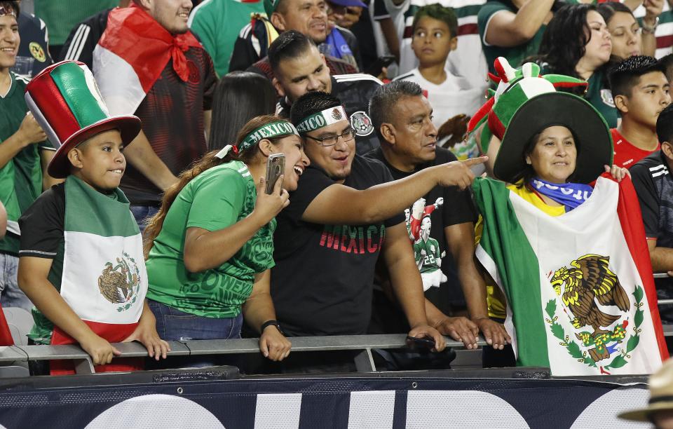 Mexico soccer fans cheer on their team during warmups  before the Concacaf Gold Cup match between Mexico and Haiti at State Farm Stadium in Glendale July 2, 2019.