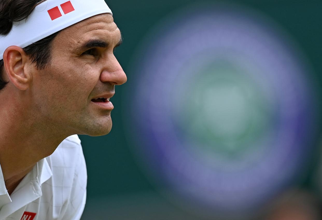 Switzerland's Roger Federer waits to receive a serve from Poland's Hubert Hurkacz during their men's quarter-finals match on the ninth day of the 2021 Wimbledon Championships at The All England Tennis Club in Wimbledon, southwest London, on July 7, 2021. - - RESTRICTED TO EDITORIAL USE (Photo by Glyn KIRK / AFP) / RESTRICTED TO EDITORIAL USE (Photo by GLYN KIRK/AFP via Getty Images)