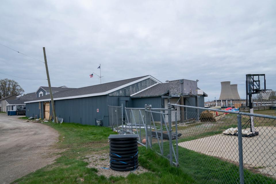 The Swan Boat Club in Newport is photographed Sunday, April 21, 2024 with Fermi ll towers in the background. The Swan Boat Club is where an alleged drunken driver smashed through a wall during a child's birthday party on Saturday.