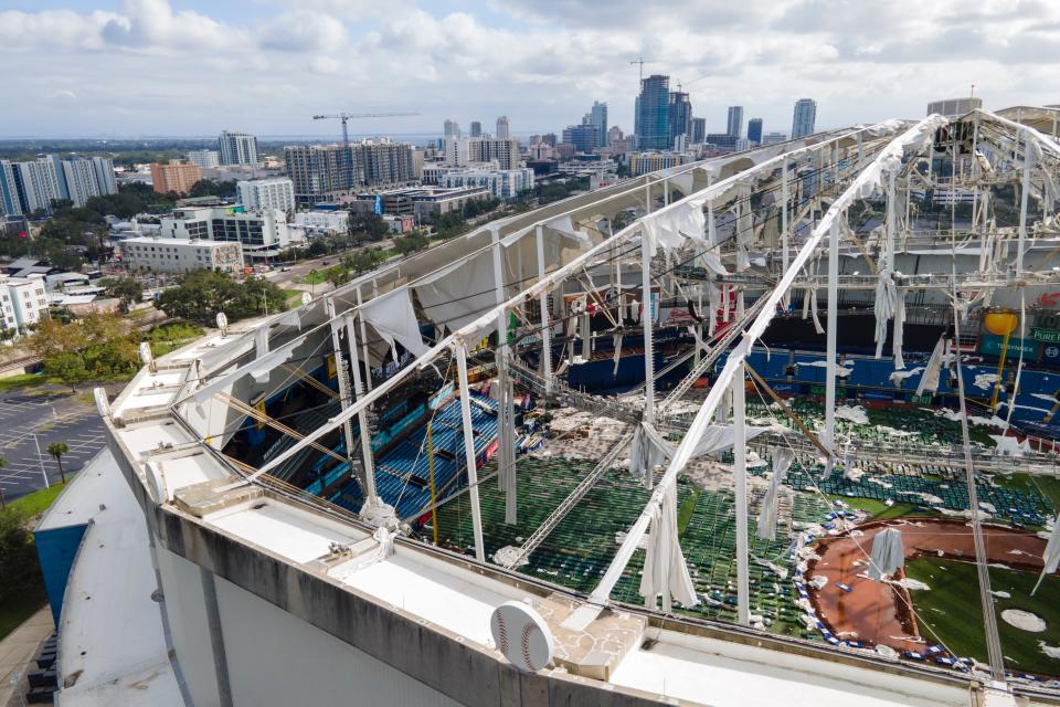 The roof of the Tropicana Field is damaged Thursday in St. Petersburg, Florida. ((AP Photo/Julio Cortez))