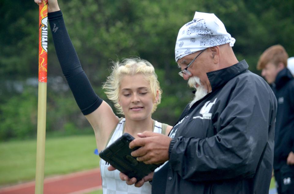 West Ottawa's Kayla Hintz talks to coach George Sipes.