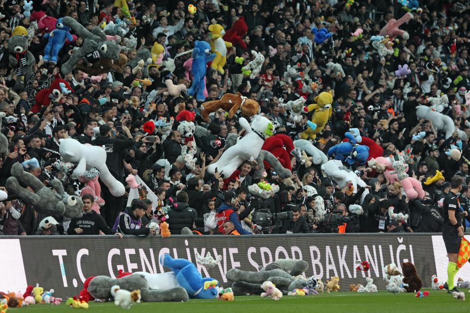 Fans of Besiktas throw Teddy bears onto the field in support for the earthquake victim children and to commemorate the dead children on February 26, 2023 in Istanbul, Türkiye. The death toll from a catastrophic earthquake that hit Turkey and Syria has topped 45,000, with search and rescue teams starting to wind down their work.