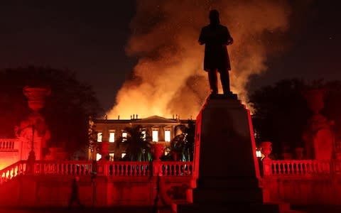 Firefighters try to extinguish a fire at the National Museum of Brazil in Rio de Janeiro - Credit: Reuters