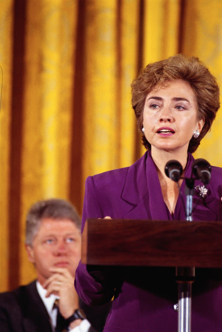 President Bill Clinton looks on as his wife, Hillary, speaks about health care in the United States. (Photo by © Wally McNamee/CORBIS/Corbis via Getty Images)