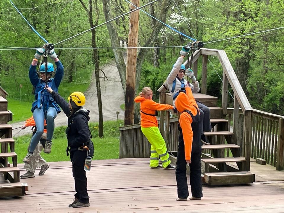 Zip-liners come in for a landing at Hocking Hills Canopy Tours.