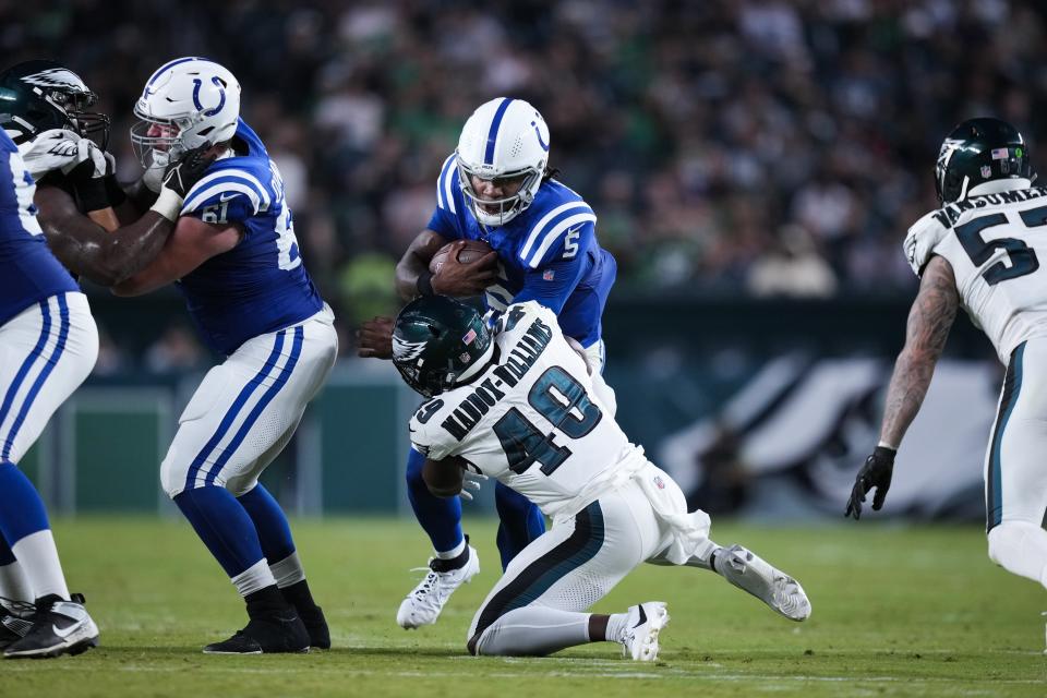 Indianapolis Colts quarterback Anthony Richardson (5) is stopped by Philadelphia Eagles' Tyreek Maddox-Williams during the first half of an NFL preseason football game Thursday, Aug. 24, 2023, in Philadelphia. (AP Photo/Matt Slocum)