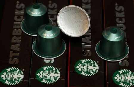 Starbucks labeled single-serve coffee capsules for Nespresso coffee makers are displayed after a news conference to announce that Nestle will sell Starbucks-branded coffee at grocery stores in Europe, Asia and Latin America at the company's headquarters in Vevey, Switzerland February 13, 2019. REUTERS/Arnd Wiegmann