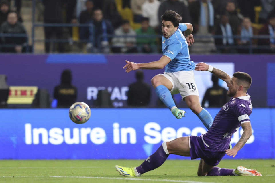 Napoli's Giovanni Simeone shoots the ball during the Italian Super Cup Semi-final soccer match between Fiorentina and Napoli at Al Awwal Park Stadium in Riyadh, Saudi Arabia, Thursday, Jan. 18, 2024. (AP Photo)