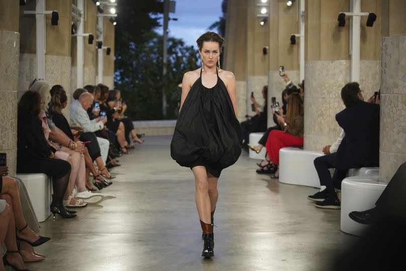 A model wears a creation by Louis Vuitton during a fashion show for the Cruise 2025 collection in the Park Guell in Barcelona, Spain, Thursday, 23 May 2024.