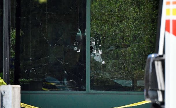 PHOTO: Bullet holes are seen in the front windows of the Old National Bank building in Louisville, Ky., April 10, 2023. (Timothy D. Easley/AP)