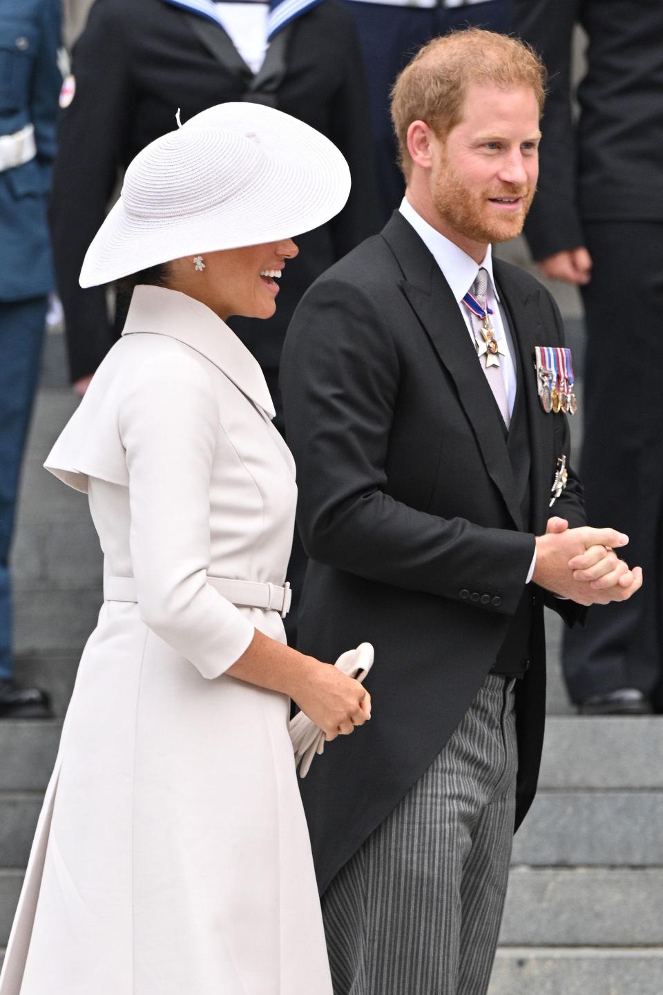 Prince Harry and Meghan Markle stand outside St Paul's Cathedral.