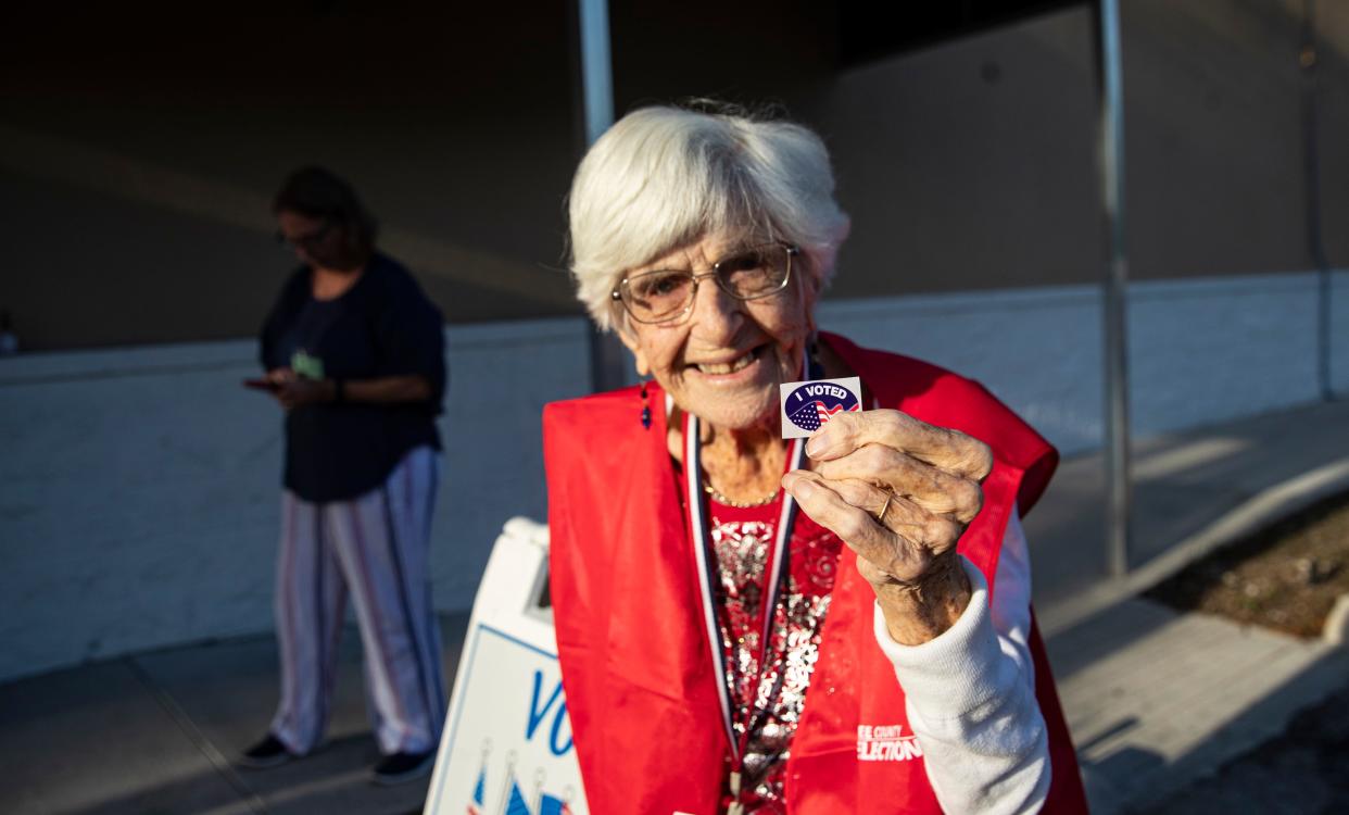 Poll worker, Vera Craig, 101, handed out 'voted' stickers at precinct 212 in the Lee County Elections Center in Fort Myers on Tuesday, August 23, 2022.