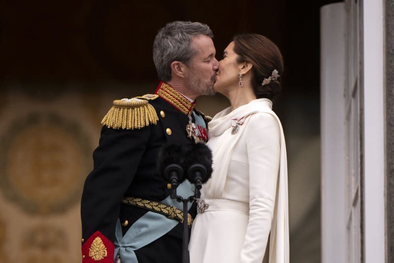 Denmark's King Frederik X (L) and Queen Mary (R) kiss on the balcony after the proclamation of the accession to the throne at Christiansborg Palace Square in Copenhagen in January. Their son, Crown Prince Christian, 18, may again act as Denmark's leader during his parents state visits which start in May. File Photo by Bo Amstrup/UPI