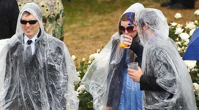 Cup day in 2010 was a bit damp, with these racegoers donning the ponchos to keep dry. Photo: Getty.