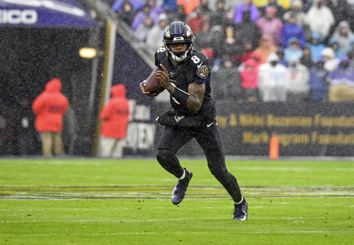 BALTIMORE, MD - DECEMBER 01: Baltimore Ravens quarterback Lamar Jackson (8) runs the ball on a quarterback keeper during the game against the San Francisco 49ers on December 1, 2019, at M&T Bank Stadium in Baltimore, MD. (Photo by Mark Goldman/Icon Sportswire via Getty Images)