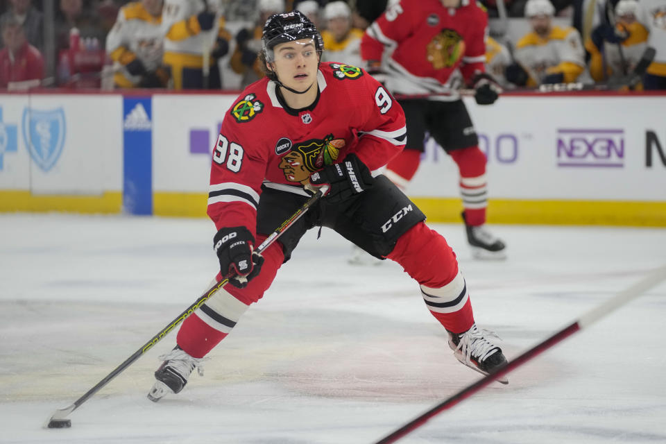 Chicago Blackhawks center Connor Bedard handles the puck during the second period an NHL hockey game against the Nashville Predators Tuesday, Dec. 5, 2023, in Chicago. (AP Photo/Erin Hooley)