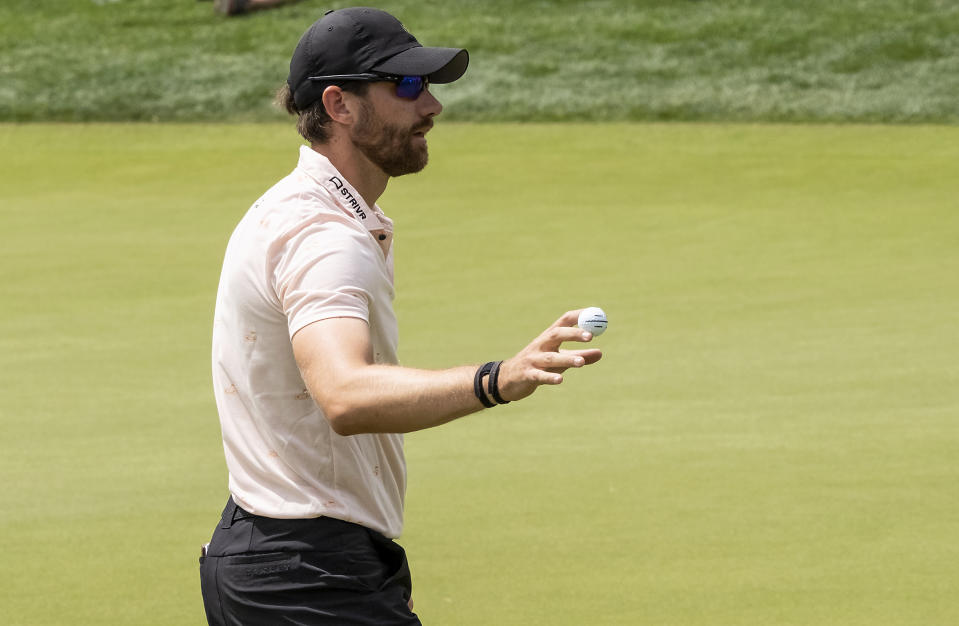 Patrick Rodgers waves to the gallery after making a birdie on the 16th hole during the second round of the Valero Texas Open golf tournament, Friday, March 31, 2023, in San Antonio. (AP Photo/Rodolfo Gonzalez )