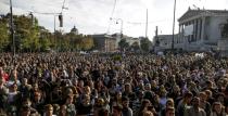 Protesters gather in front of the Austrian parliament during a pro-Asylum demo to welcome refugees in Vienna on October 3, 2015