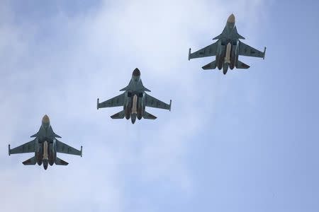 Russian military jets flying from Syria are seen shortly before landing on the runway of an airbase in Buturlinovka in Voronezh region, Russia, March 15, 2016. REUTERS/Russian Ministry of Defence/Olga Balashova/Handout via Reuters