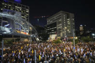 People attend a rally demanding a cease-fire deal and the immediate release of hostages held by Hamas in the Gaza Strip in Tel Aviv, Israel, on Tuesday, Sept. 3, 2024. (AP Photo/Ariel Schalit)