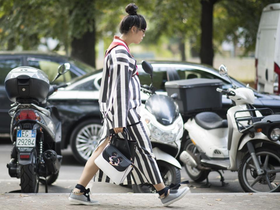 Blogger Sussie Bubble takes a morning stroll through Milan in lots of striped layers and platform shoes.