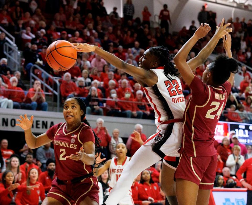 Florida State’s Alexis Tucker and Amaya Bonner force a turnover by N.C. State’s Saniya Rivers late in the second half of the Wolfpack’s 88-80 win on Thursday, Jan. 4, 2023, at Reynolds Coliseum in Raleigh, N.C.