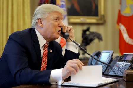 U.S. President Donald Trump congratulates Prime Minister Leo Varadkar of Ireland during a phone call from inside the Oval Office of the White House in Washington, U.S., June 27, 2017. REUTERS/Carlos Barria