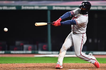 Apr 20, 2019; Cleveland, OH, USA; Atlanta Braves second baseman Ozzie Albies (1) hits an RBI single during the ninth inning against the Cleveland Indians at Progressive Field. Mandatory Credit: Ken Blaze-USA TODAY Sports